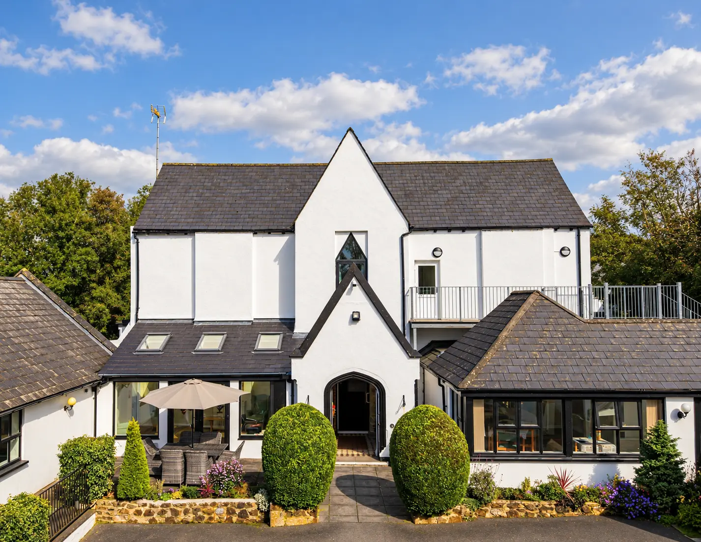 The white gabled Springfields Residential Home building behind its gardens